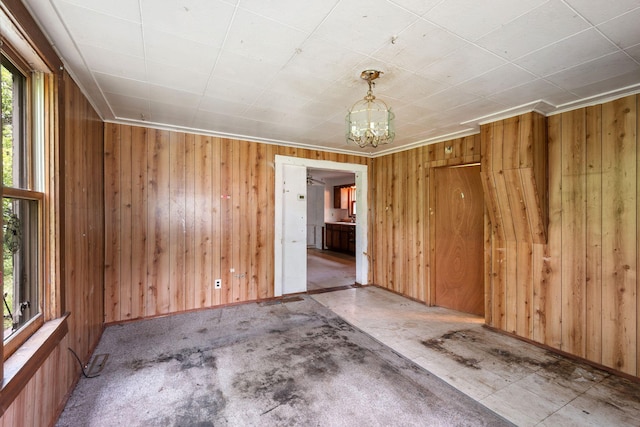 318 Austin Ave, Litchfield, MN 55355 - empty room featuring wood walls and a chandelier