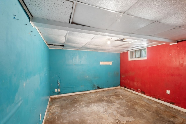 318 Austin Ave, Litchfield, MN 55355 - below grade area featuring baseboards and a drop ceiling