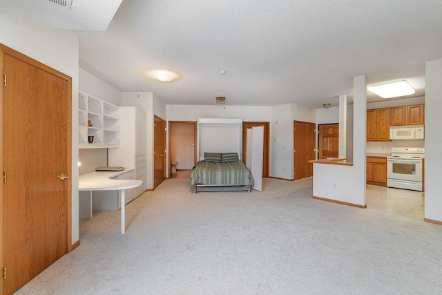 4824 53rd St Unit 410, Minneapolis, MN 55417 - unfurnished bedroom with light colored carpet, baseboards, a textured ceiling, and ensuite bath
