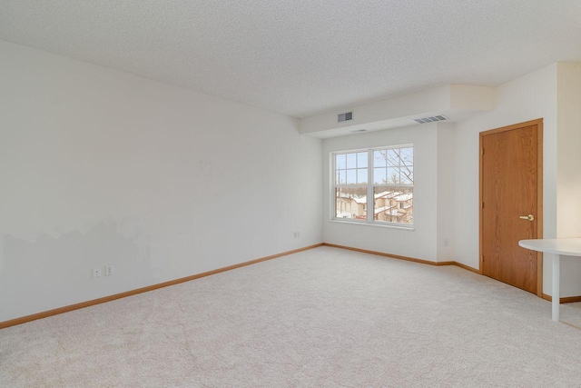 4824 53rd St Unit 410, Minneapolis, MN 55417 - carpeted spare room featuring a textured ceiling and baseboards