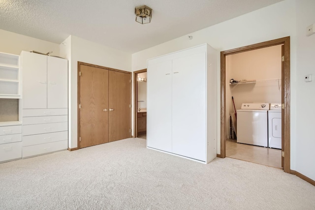 4824 53rd St Unit 410, Minneapolis, MN 55417 - unfurnished bedroom featuring washing machine and clothes dryer, carpet, baseboards, and connected bathroom