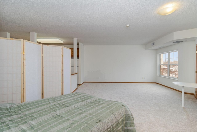 4824 53rd St Unit 410, Minneapolis, MN 55417 - unfurnished bedroom with light carpet, a textured ceiling, and baseboards