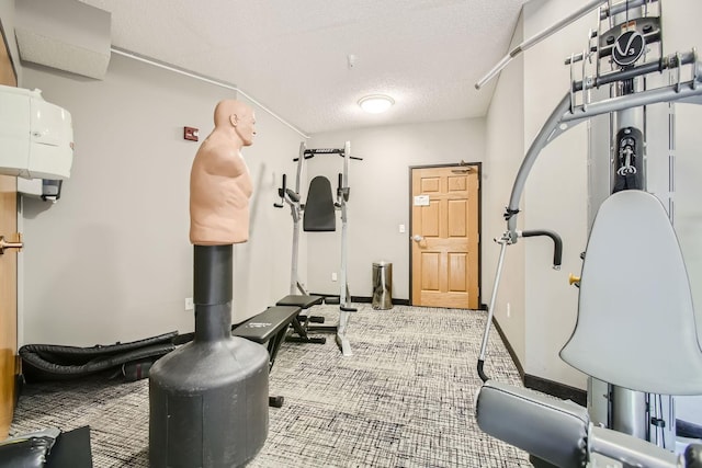 4824 53rd St Unit 410, Minneapolis, MN 55417 - workout area featuring a textured ceiling, carpet floors, and baseboards