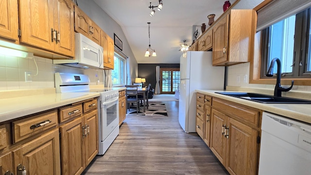 210 10th Ave N # 1, Cold Spring, MN 56320 - kitchen with white appliances, a sink, vaulted ceiling, dark wood-style flooring, and tasteful backsplash