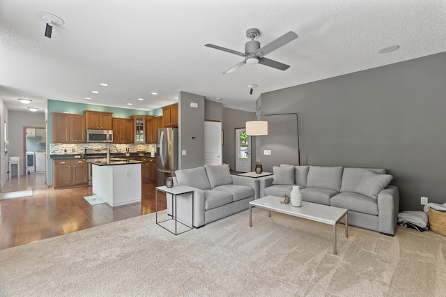 4231 Maple Hurst Dr N, Rockford, MN 55373 - living area featuring a ceiling fan, a textured ceiling, light wood-style flooring, and recessed lighting