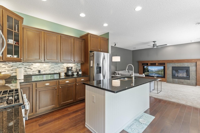 4231 Maple Hurst Dr N, Rockford, MN 55373 - kitchen featuring appliances with stainless steel finishes, dark wood-style floors, open floor plan, a textured ceiling, and a ceiling fan