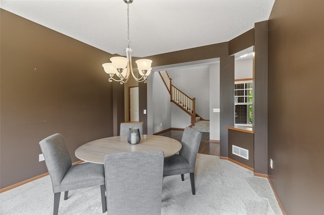 4231 Maple Hurst Dr N, Rockford, MN 55373 - dining area with a chandelier, light carpet, and stairway