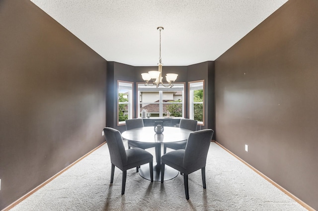 4231 Maple Hurst Dr N, Rockford, MN 55373 - dining room with a chandelier, carpet flooring, and a textured ceiling