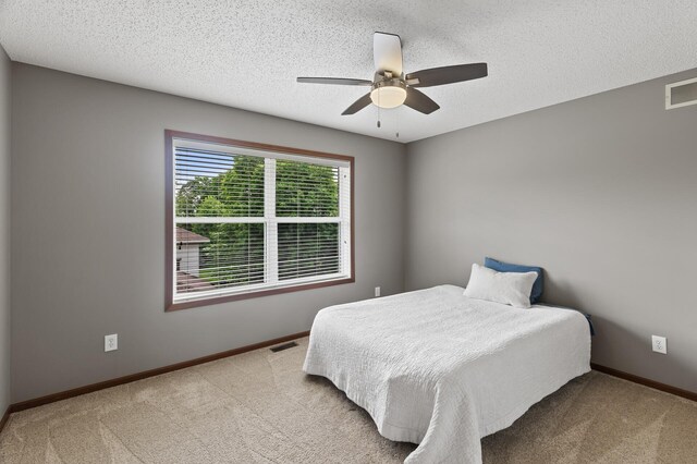 4231 Maple Hurst Dr N, Rockford, MN 55373 - bedroom with carpet flooring, a textured ceiling, and a ceiling fan