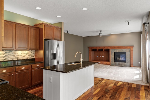 4231 Maple Hurst Dr N, Rockford, MN 55373 - kitchen with stainless steel fridge with ice dispenser, dark wood-style floors, ceiling fan, tasteful backsplash, and a textured ceiling