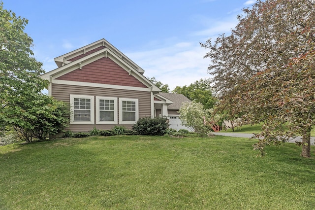 4231 Maple Hurst Dr N, Rockford, MN 55373 - view of front of property with a front yard and an attached garage