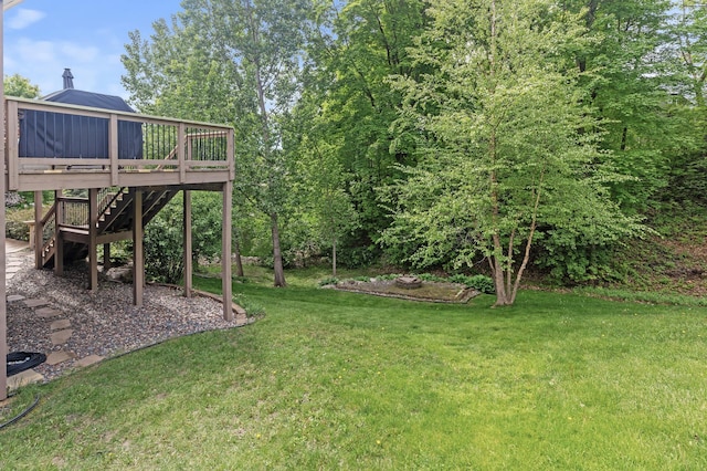 4231 Maple Hurst Dr N, Rockford, MN 55373 - view of grassy yard with a wooden deck and stairway