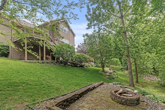 4231 Maple Hurst Dr N, Rockford, MN 55373 - view of grassy yard featuring an outdoor fire pit and a wooden deck
