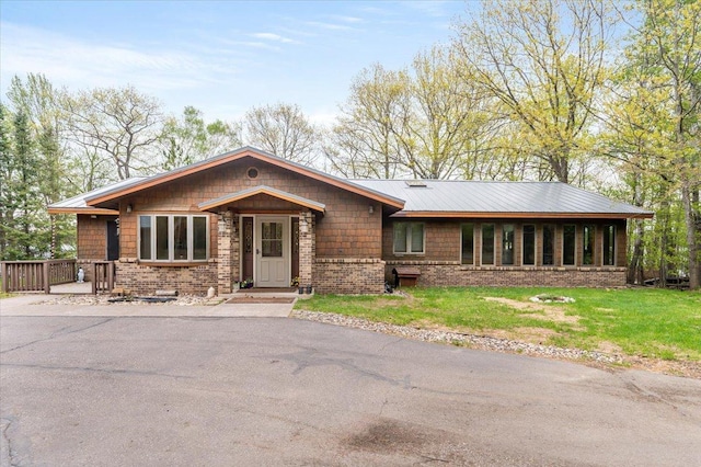 11567 S Lake Blvd, Lake Nebagamon, WI 54849 - view of front of house with a front yard and brick siding