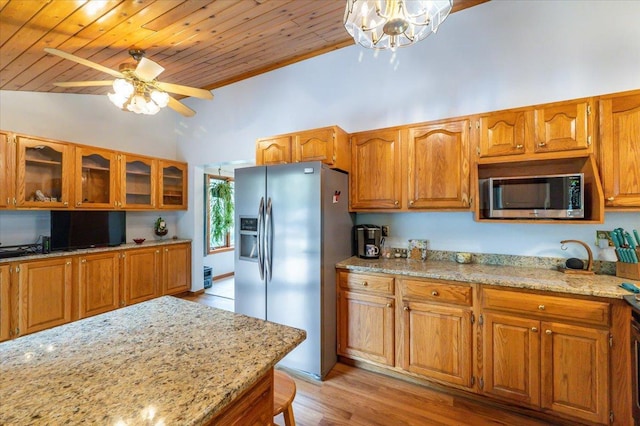 11567 S Lake Blvd, Lake Nebagamon, WI 54849 - kitchen featuring appliances with stainless steel finishes, lofted ceiling, wood ceiling, brown cabinets, and glass insert cabinets