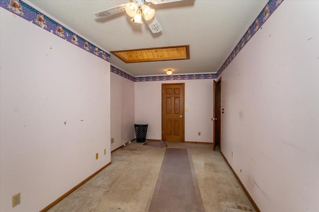 11567 S Lake Blvd, Lake Nebagamon, WI 54849 - empty room featuring a ceiling fan and baseboards