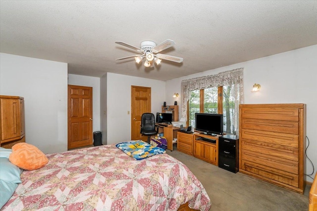 11567 S Lake Blvd, Lake Nebagamon, WI 54849 - bedroom featuring light colored carpet, a desk, ceiling fan, and a textured ceiling