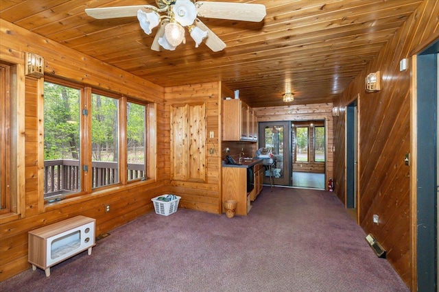 11567 S Lake Blvd, Lake Nebagamon, WI 54849 - kitchen with wooden walls, carpet flooring, wood ceiling, and ceiling fan
