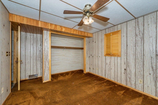 11567 S Lake Blvd, Lake Nebagamon, WI 54849 - unfurnished bedroom featuring carpet floors, a closet, baseboards, and ceiling fan