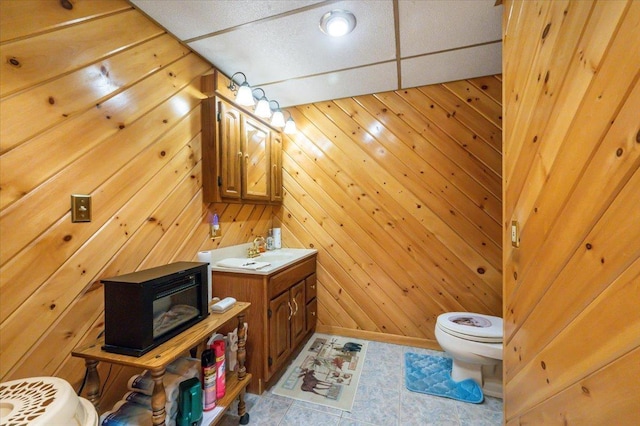 11567 S Lake Blvd, Lake Nebagamon, WI 54849 - half bath featuring toilet, vanity, and wooden walls