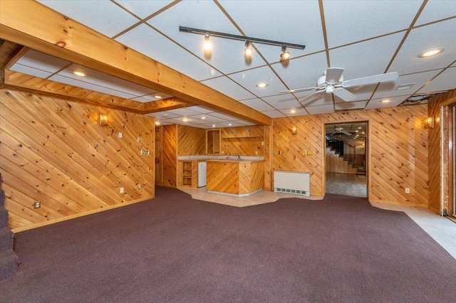 11567 S Lake Blvd, Lake Nebagamon, WI 54849 - finished below grade area featuring wood walls, carpet flooring, recessed lighting, bar area, and a ceiling fan
