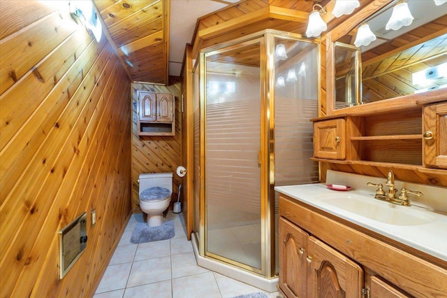 11567 S Lake Blvd, Lake Nebagamon, WI 54849 - full bathroom featuring wood walls, vanity, toilet, tile patterned flooring, and a stall shower