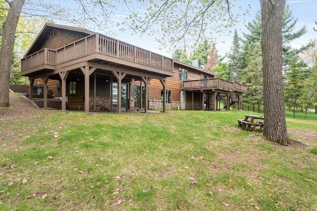 11567 S Lake Blvd, Lake Nebagamon, WI 54849 - rear view of house with a deck and a lawn