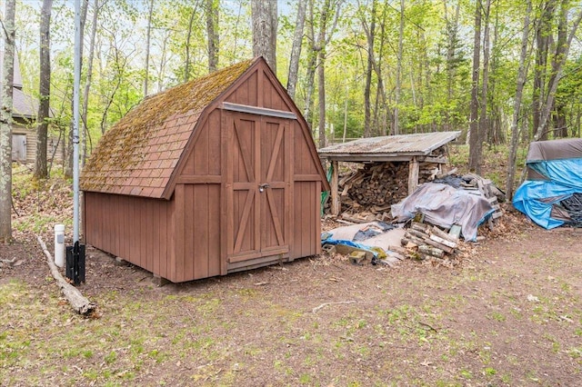 11567 S Lake Blvd, Lake Nebagamon, WI 54849 - view of shed with a view of trees