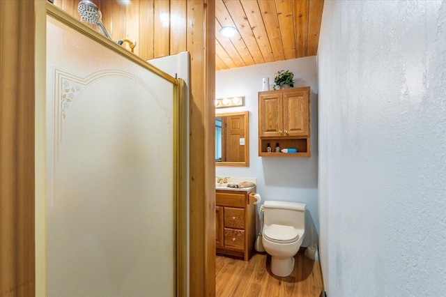 11567 S Lake Blvd, Lake Nebagamon, WI 54849 - bathroom with toilet, vanity, wood finished floors, and wooden ceiling