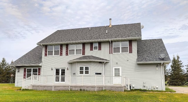 8848 Leander Rd, Angora Twp, MN 55723 - back of house featuring a yard, a deck, and a shingled roof
