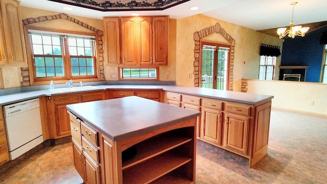8848 Leander Rd, Angora Twp, MN 55723 - kitchen with dishwasher, a sink, a chandelier, a peninsula, and a kitchen island
