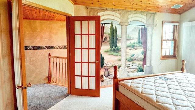 8848 Leander Rd, Angora Twp, MN 55723 - carpeted bedroom with wood ceiling and french doors