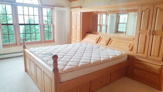 8848 Leander Rd, Angora Twp, MN 55723 - bedroom featuring light colored carpet and a baseboard heating unit