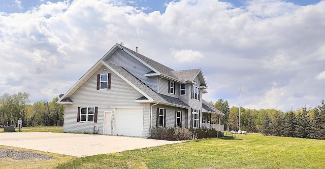 8848 Leander Rd, Angora Twp, MN 55723 - view of front facade featuring a front yard, an attached garage, concrete driveway, and a shingled roof