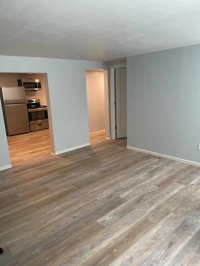 4429 Portland Ave, Minneapolis, MN 55407 - spare room featuring baseboards and wood finished floors
