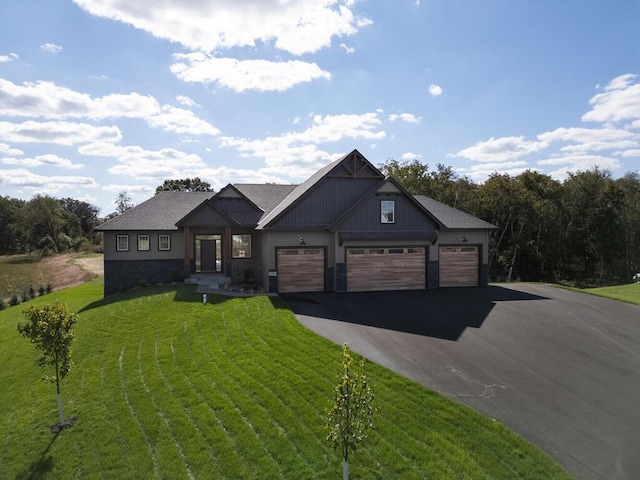 20666 Tamarack St NW, Oak Grove, MN 55011 - view of front of home featuring a front lawn, driveway, and an attached garage