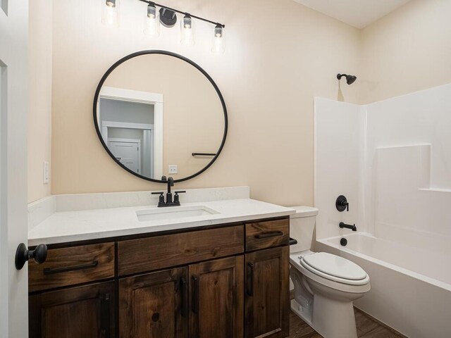 20666 Tamarack St NW, Oak Grove, MN 55011 - full bath with vanity, toilet, tub / shower combination, and wood finished floors