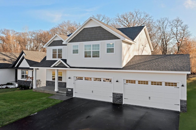 1708 Misty Cir, Buffalo, MN 55313 - craftsman house featuring stone siding, asphalt driveway, a front yard, a porch, and an attached garage