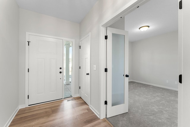 1708 Misty Cir, Buffalo, MN 55313 - entryway with baseboards and wood finished floors