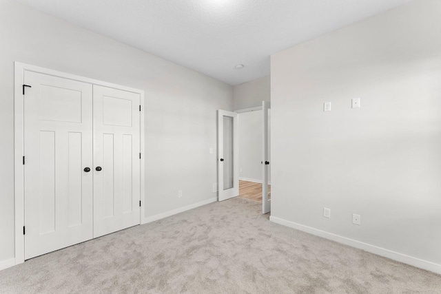 1708 Misty Cir, Buffalo, MN 55313 - unfurnished bedroom featuring carpet floors, baseboards, and a closet