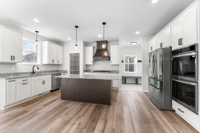 1708 Misty Cir, Buffalo, MN 55313 - kitchen featuring appliances with stainless steel finishes, premium range hood, recessed lighting, a kitchen island, and white cabinetry