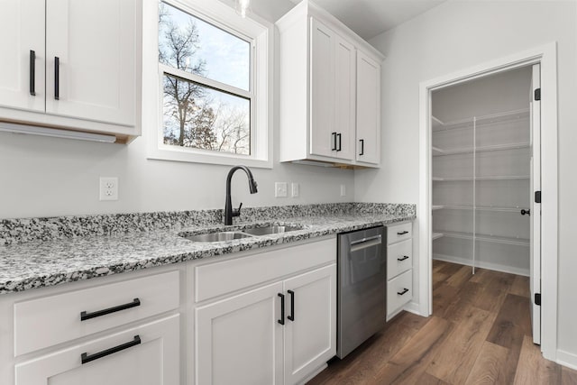 1708 Misty Cir, Buffalo, MN 55313 - kitchen featuring stainless steel dishwasher, a sink, wood finished floors, light stone counters, and white cabinetry
