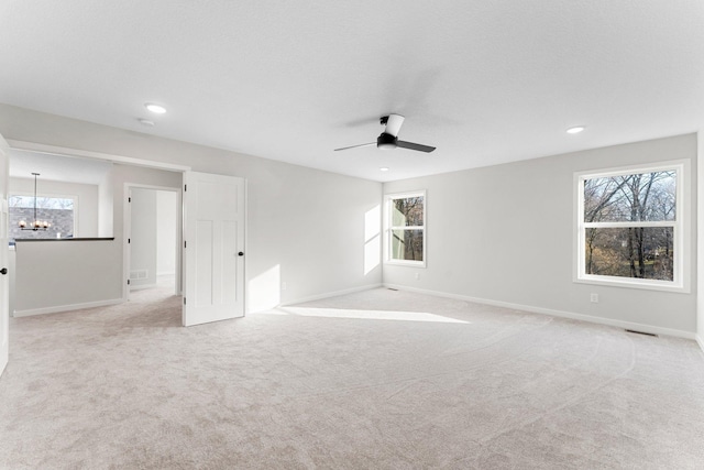 1708 Misty Cir, Buffalo, MN 55313 - unfurnished room with a chandelier, healthy amount of natural light, a ceiling fan, light carpet, and recessed lighting