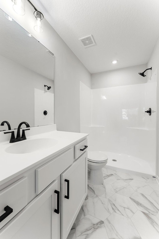 1708 Misty Cir, Buffalo, MN 55313 - full bathroom featuring a shower, marble look tile flooring, vanity, a textured ceiling, and toilet