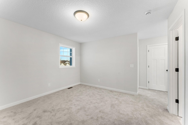 1708 Misty Cir, Buffalo, MN 55313 - empty room featuring light carpet, a textured ceiling, and baseboards