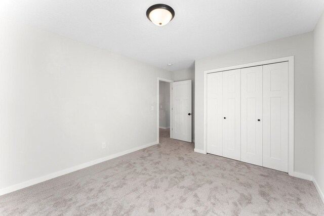 1708 Misty Cir, Buffalo, MN 55313 - unfurnished bedroom featuring carpet floors, baseboards, and a closet