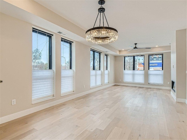 4745 Minnehaha Ave Unit 101, Minneapolis, MN 55406 - spare room with a chandelier, light wood-type flooring, baseboards, and recessed lighting