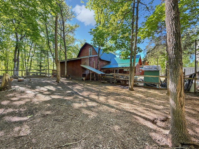 7215 Little Dip Ln NE, Bemidji, MN 56601 - back of house featuring a barn, metal roof, and an outdoor structure