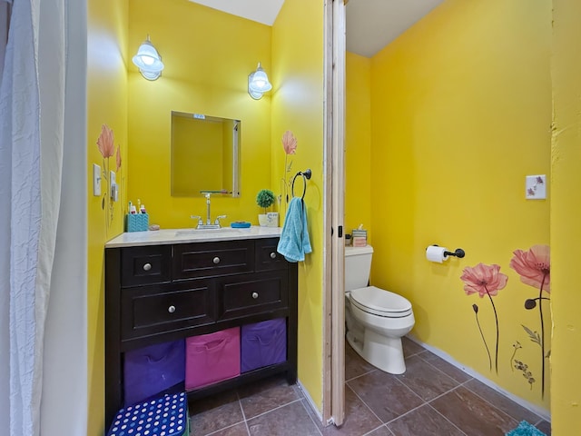 7215 Little Dip Ln NE, Bemidji, MN 56601 - bathroom with vanity, toilet, and tile patterned floors