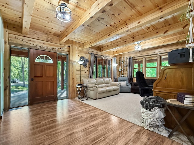7215 Little Dip Ln NE, Bemidji, MN 56601 - living area with wood finished floors, wood ceiling with exposed beams, and wooden walls